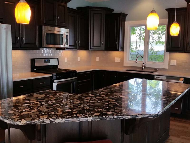 Black Marinace Granite kitchen island becomes the center piece of the room.