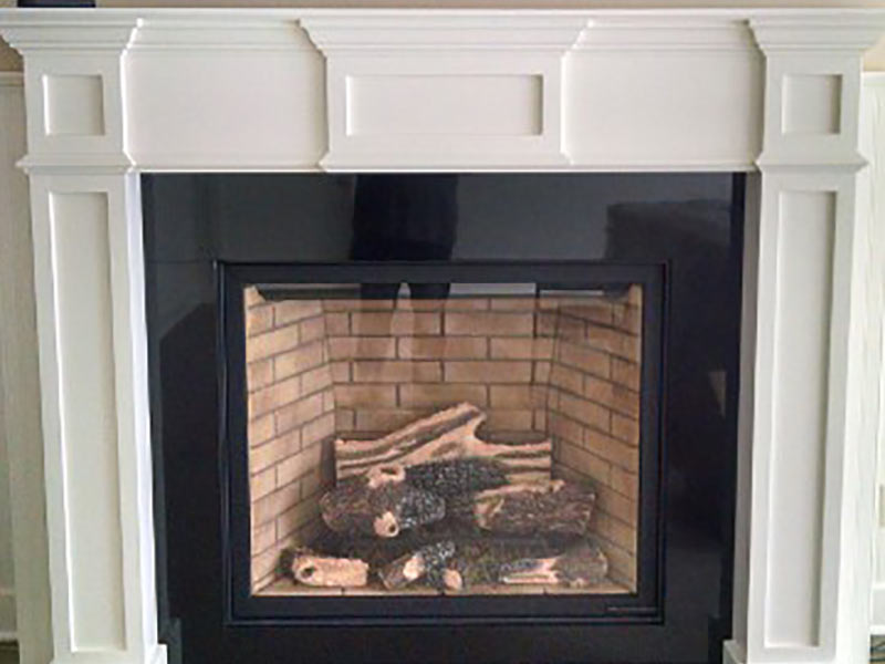 Black Absolute, or Absolute Black, Granite fireplace surround and mantle.