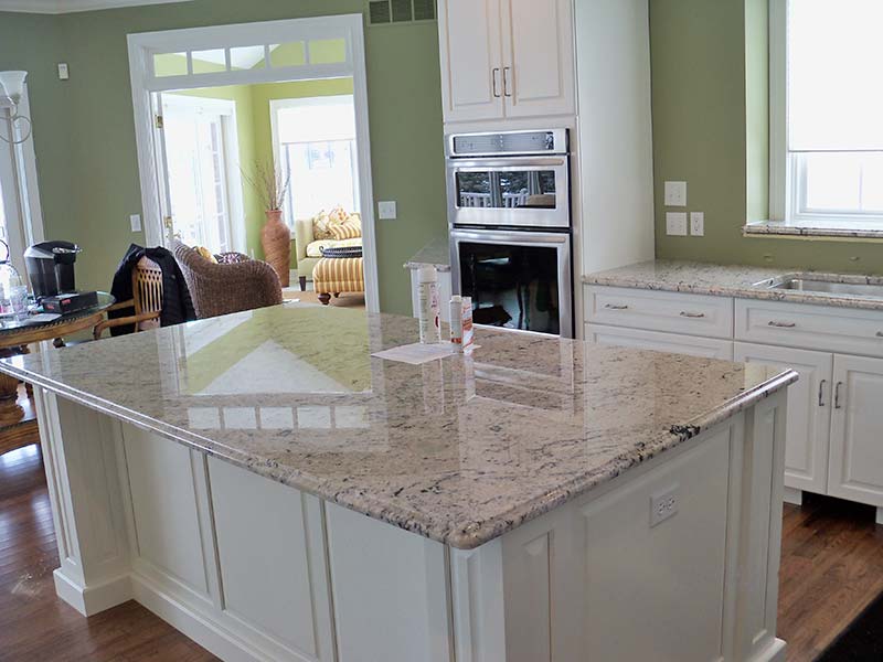 This Delicatus Kitchen island looks great over white cabinets with a light to medium green decor. 