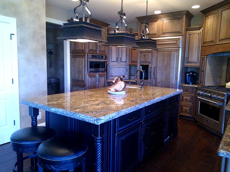 This Stormy Night Granite kitchen island is the focal point of the kitchen.